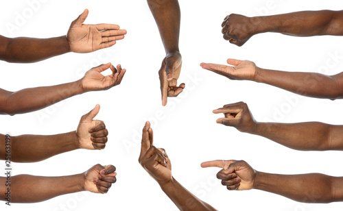 Afro-American man showing different gestures on white background, closeup view of hands photo