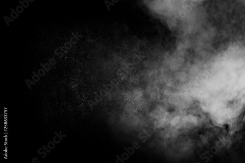 abstract white smoke powder explosion on black background