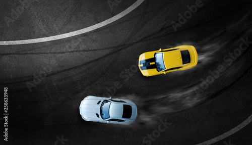 Obraz na plátne Aerial top view two cars drifting battle on race track, Two race cars view from above