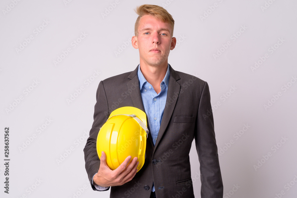 Portrait of young blonde businessman with suit as engineer Portrait of young blonde businessman with suit as engineer