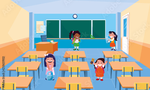 happy little school interracial girls in the classroom