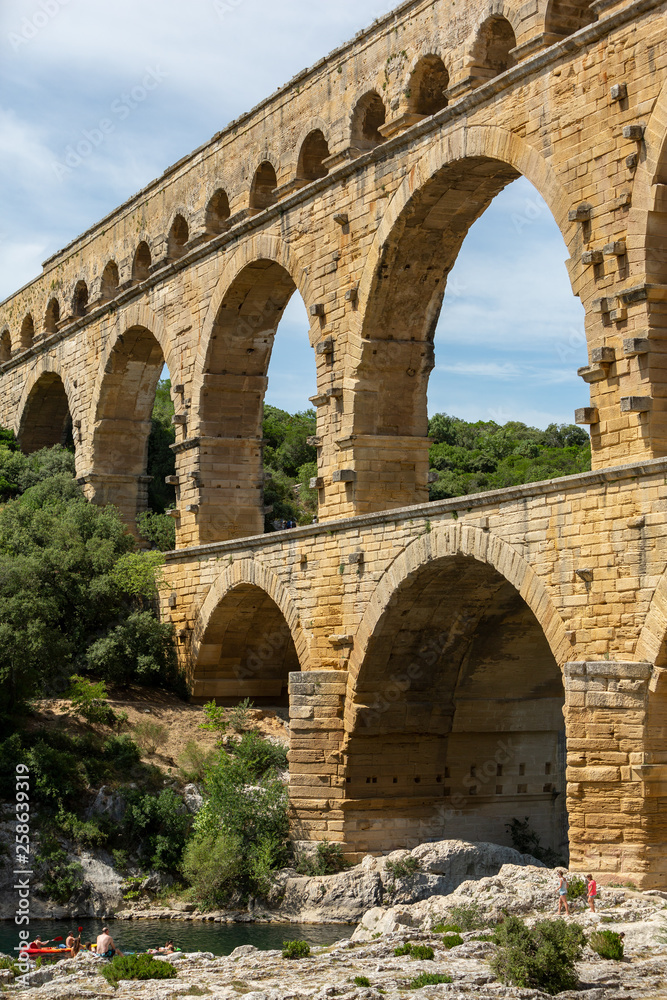 Gard, France July 13th 2015 : The magnificent three tiered Pont Du Gard aqueduct was constructed by Roman engineers in the 1st century AD in the south of France