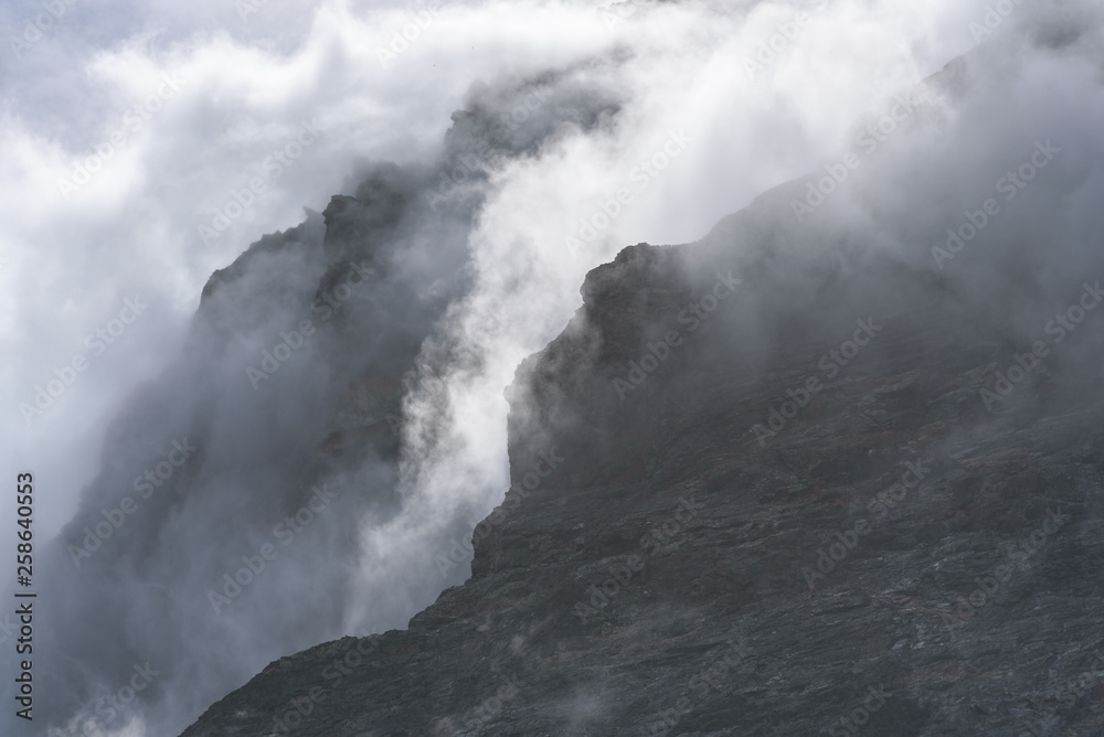 Dramatic fog shrouded rock face as a nature background, Drygalski Fjord, South Georgia