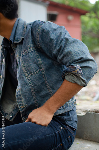 young man in denim jacket © Yogendra