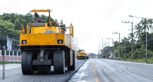 Close view on the road roller working on the road construction site.