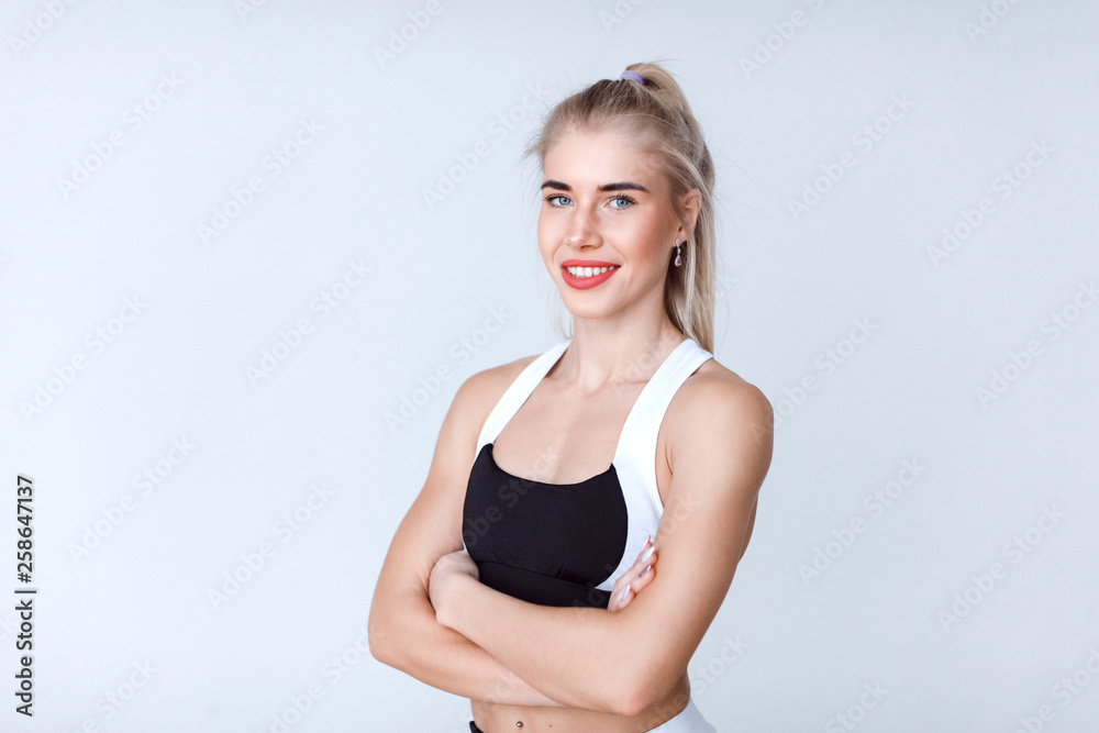 Portrait of a beautiful athletic woman in sportswear. Portrait of a beautiful athletic woman in sportswear.
