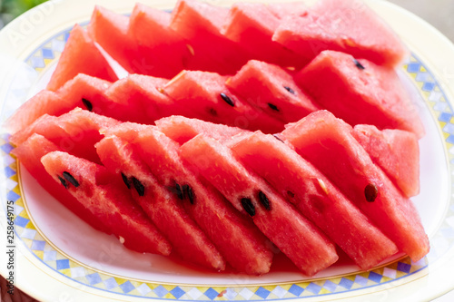 Tasty sliced watermelon in a dish.