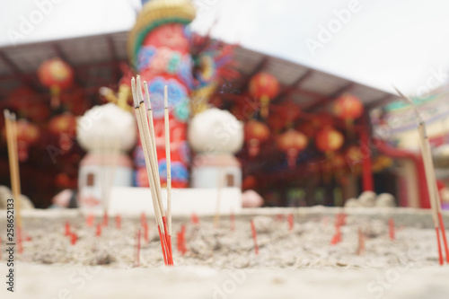 Incense stick in sand pot at chinese temple