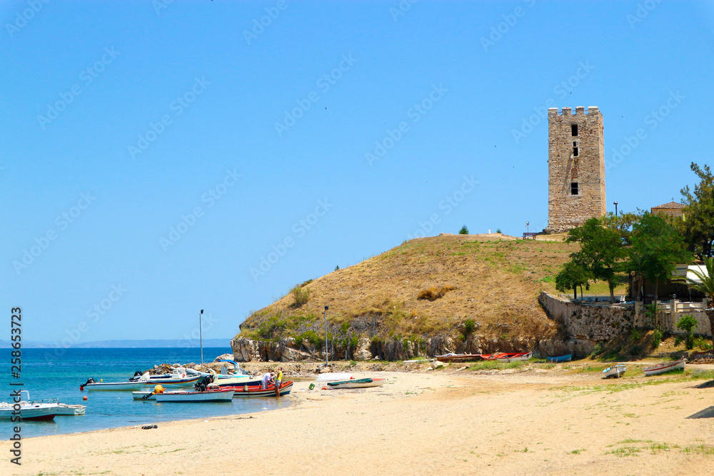Panoramic view of the beach in Nea Fokea, Greece with ruins of ancient byzantine tower