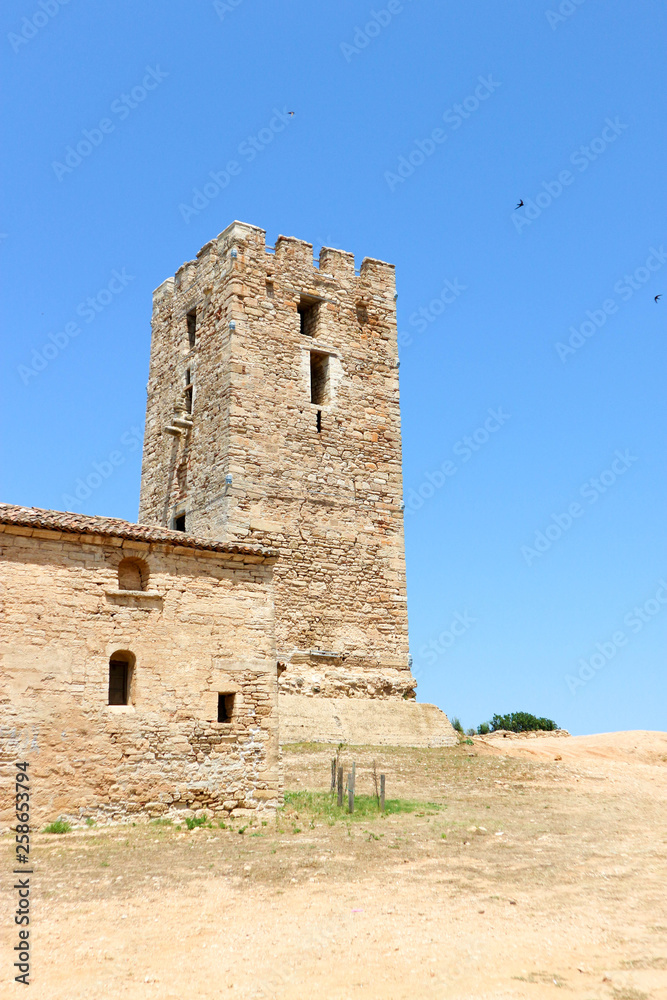 view of ancient church and byzantine tower in Nea Fokea, Greece 