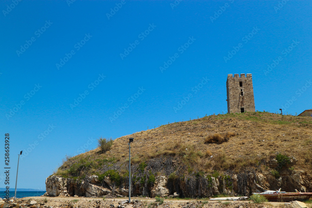 Old venetian tower on the mediterranean coast of Greece
