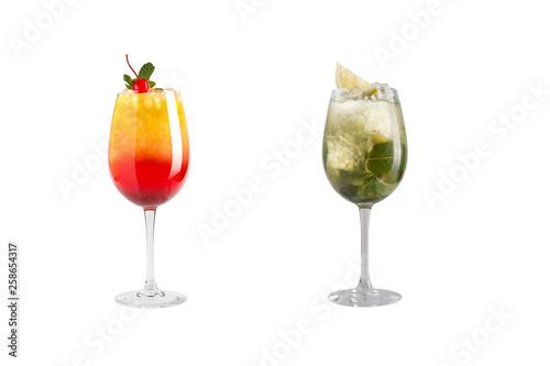 Alcohol cocktail with mint, fruit and berries on a white background. A set of two cocktails in glass goblets on a long leg.