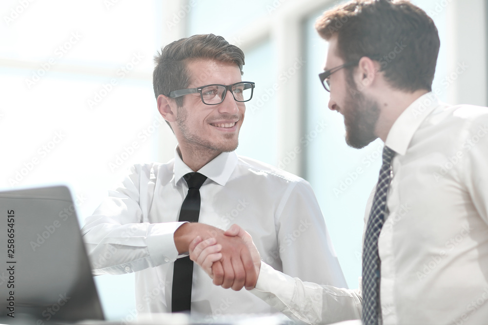 Fototapeta premium handshake business colleagues sitting at their Desk