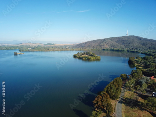 Panoramic view of Canberra (Australia) in daytime, featuring Lake Burley Griffin, Black Mountain and Telstra Tower.