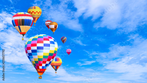 Colorful hot air balloon fly over blue sky 2