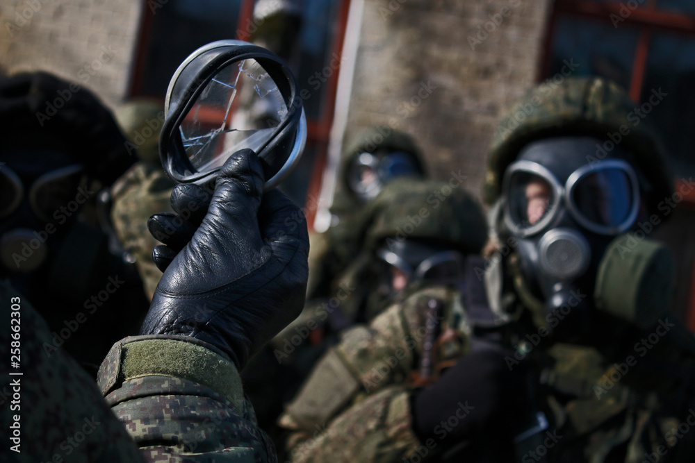 Military in gas mask. Broken glass Military. Russian soldier. Russian  landing party. Hard work. Stock Photo | Adobe Stock