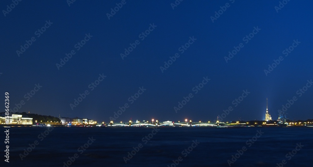View of St. Petersburg at night. Neva river, bridges, night lighting. Russia.