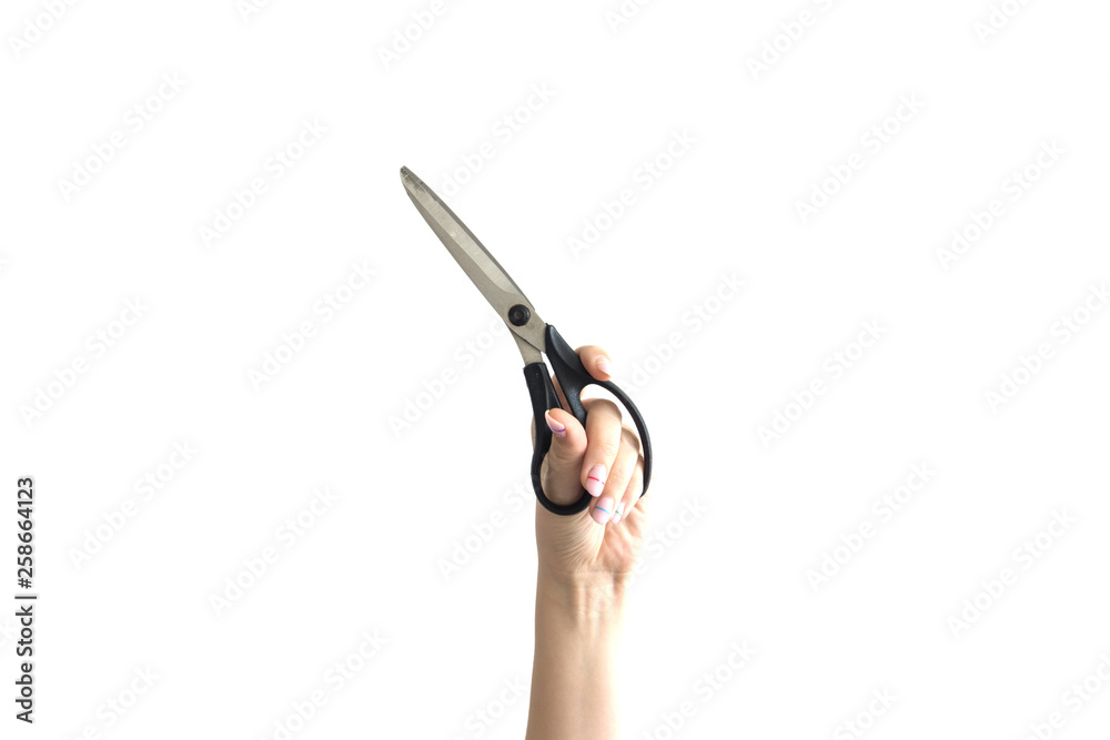 Obraz premium girl holds scissors on white background