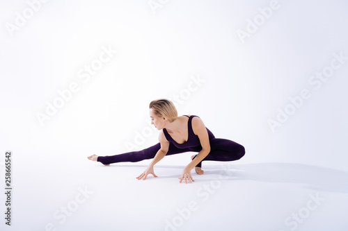 Nice good looking blonde woman doing exercises