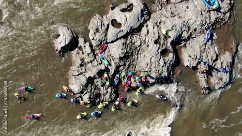 Aerial view of kayakers on a wild river photo