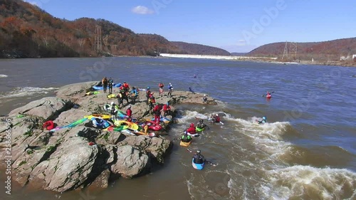 Playboating, kayaking on a wild river, freestyle whitewater kayaking and canoeing photo