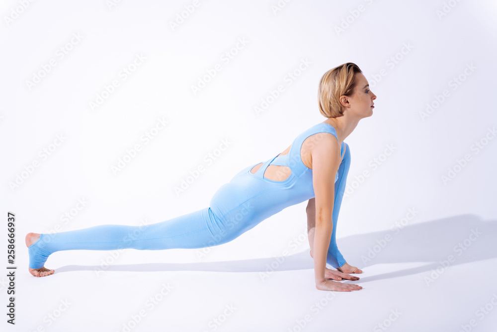 Serious skilled woman focusing on her workout Serious skilled woman focusing on her workout
