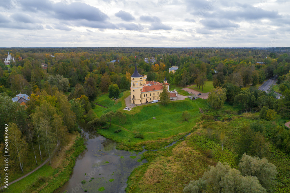 The old Bip Castle in the autumn landscape (aerial photography). Pavlovsk, neighborhood of St. Petersburg, Russia