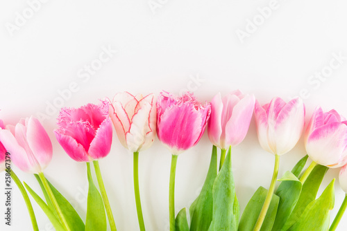 Fototapeta Naklejka Na Ścianę i Meble -  Pink and white bouquet of tulips on white background.