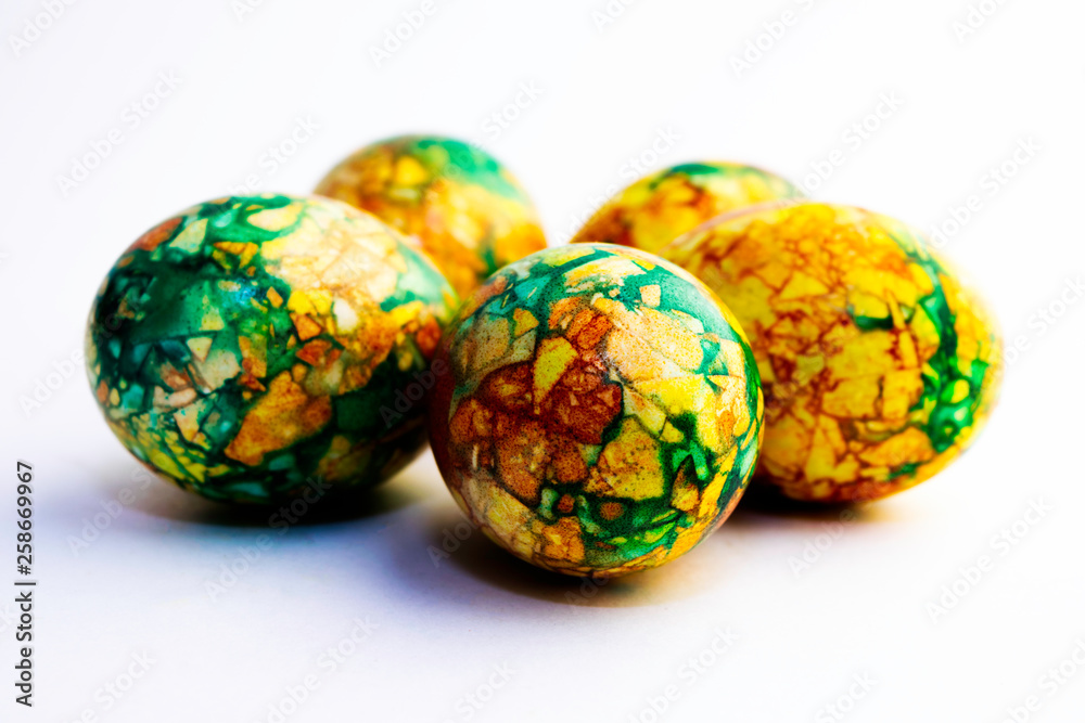 handmade yellow green easter eggs painted marbled over white background handmade yellow green easter eggs painted marbled over white background