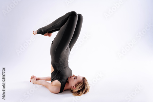 Good looking young woman bending her knees