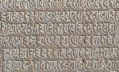 ancient indian hieroglyphs embossed on the stone walls