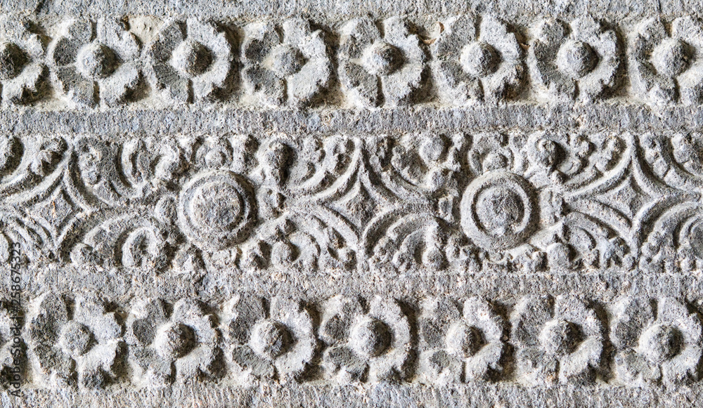 ancient indian patterns carved in stone walls