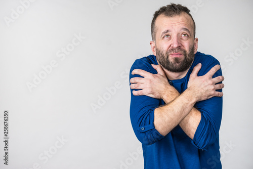 Fotografie, Obraz Man feeling cold gesturing