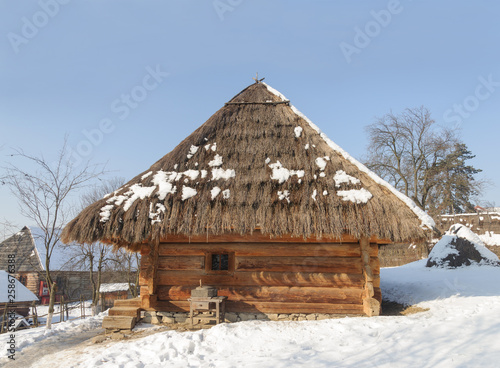 Old Ukrainian wooden peasant's house photo