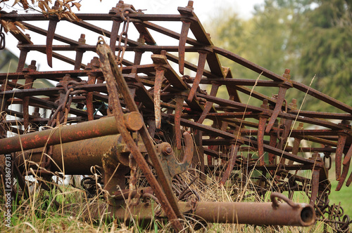 Fototapeta close-up of rusty harrow on a farmyard