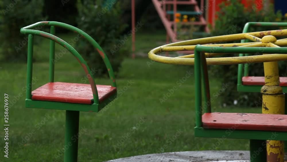 The carousel turns without children. the kindergarten was empty. A state of emergency because of the quarantine covid-19 The carousel turns without children. the kindergarten was empty. A state of emergency because of the quarantine covid-19