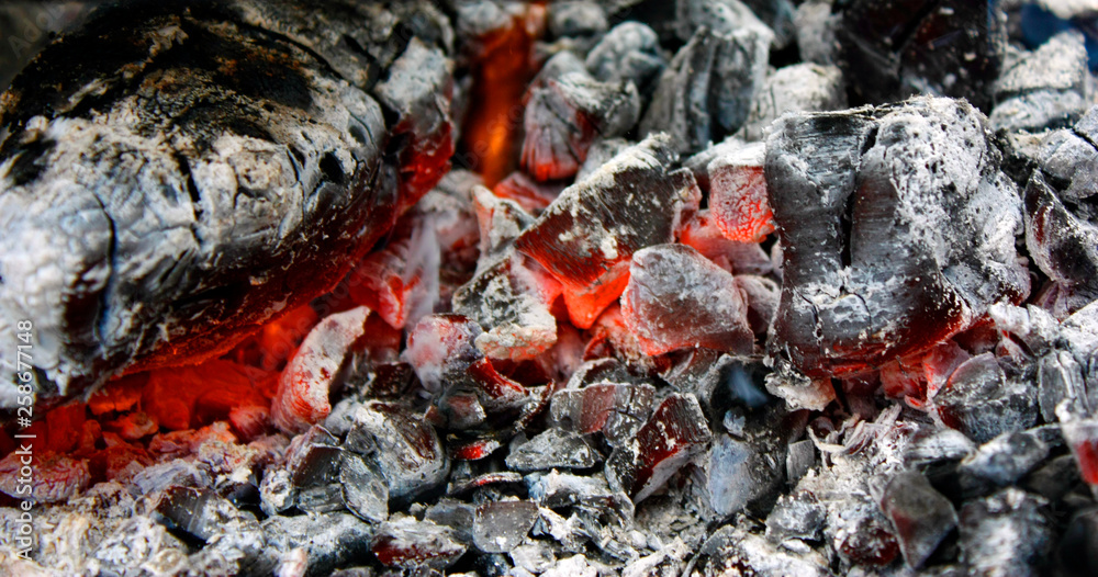 burning hot coal in the grill close up burning hot coal in the grill close up