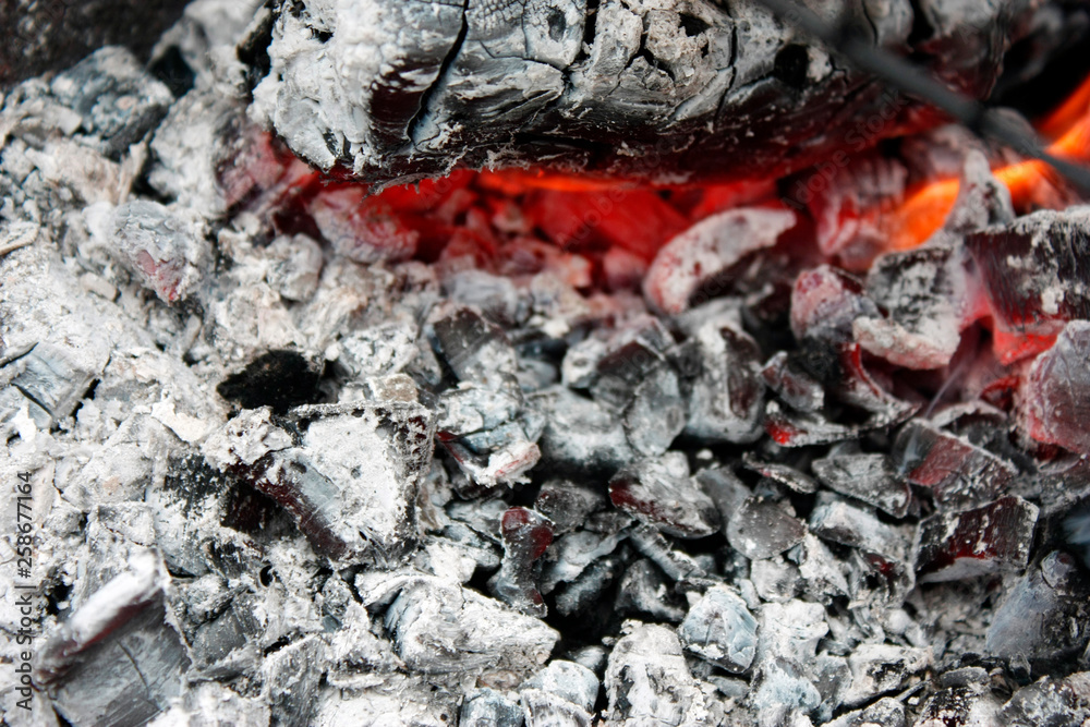 burning hot coal in the grill close up burning hot coal in the grill close up