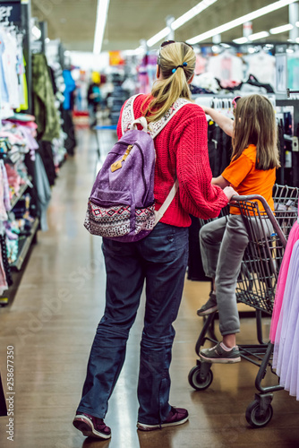 Mother and daughter shopping in a mall 