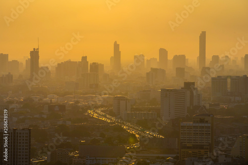 Bangkok, Thailand - 21 June 2018, City view showing dust, air pollution of Thailand at 2.5 microns or less (PM 2.5), higher than the standard level in the air around Bangkok. In the evening