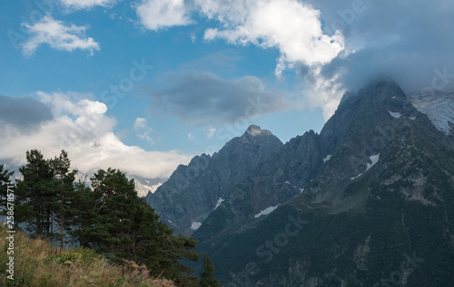 Panorama of mountains and forest scene in national park of Dombay, Russia