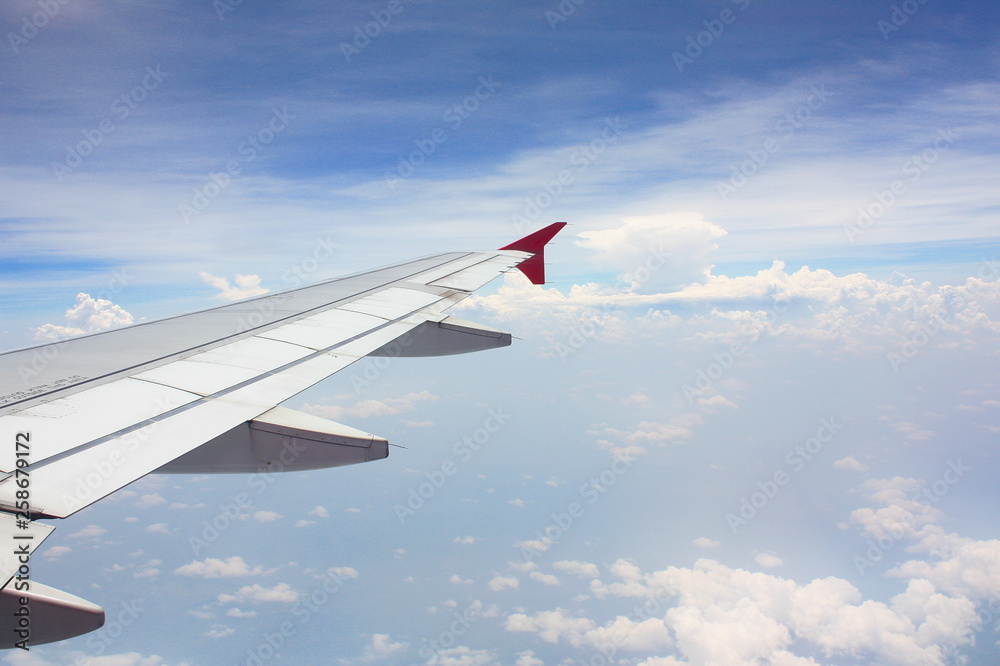 airplane wing look from airplane window above the sky airplane wing look from airplane window above the sky