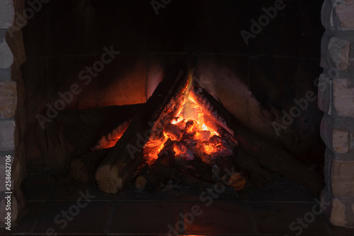 Close up shot of burning firewood in the fireplace