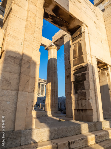 Columns of Propylaea gate entrance of Acropolis, Athens, Greece against blue sky