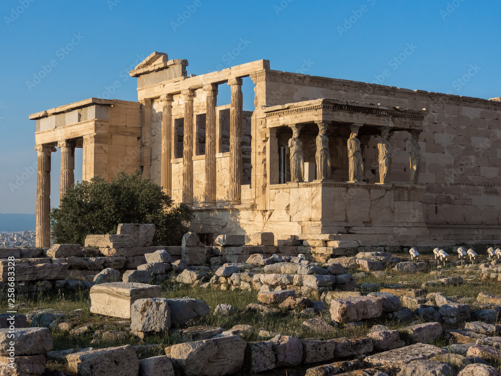 View of Erechtheion and porch of Caryatids on Acropolis, Athens, Greece, against sunset