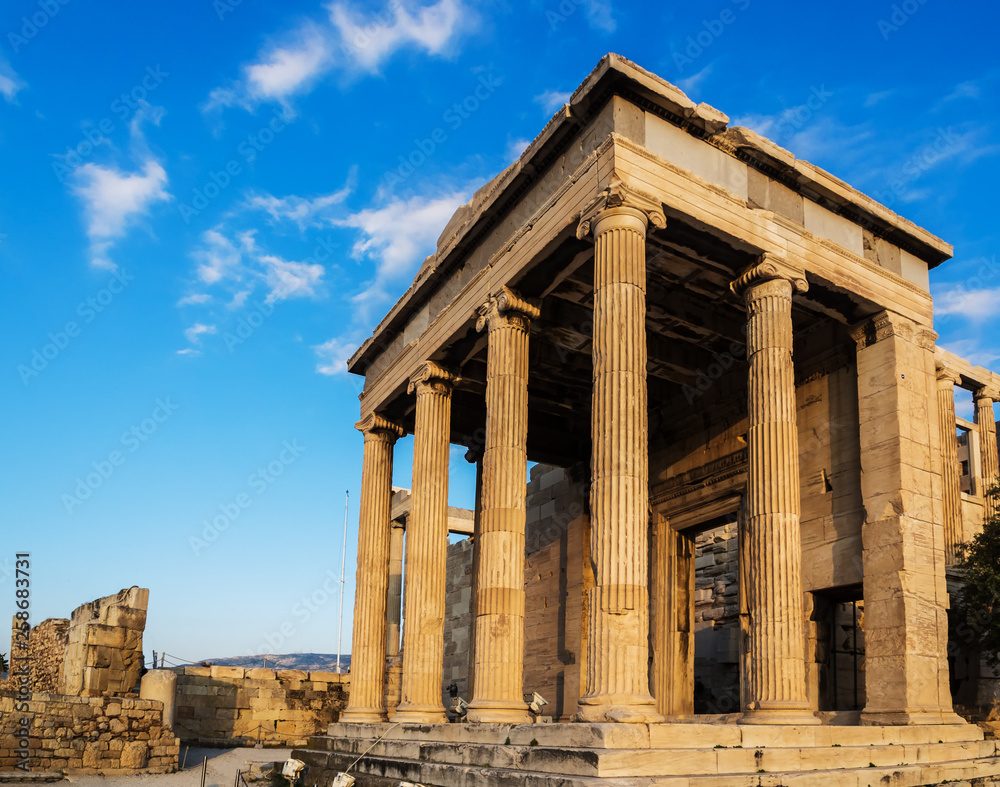 Porch of Poseidon temple as part of Erechtheion on Acropolis, Athens, Greece against blue sky