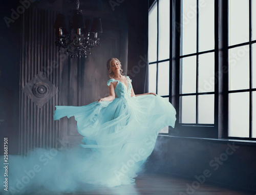 Fototapet The magical transformation of Cinderella into a beautiful princess in a luxurious dress
