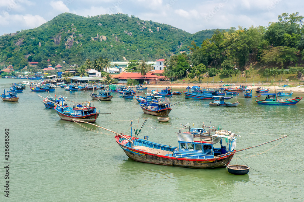 Traditional colorful fishing boats on the river Cai in Nha Trang, Vietnam