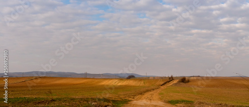 Rural scenery in Moldavia, along the national road E85. Hills covered in golden light