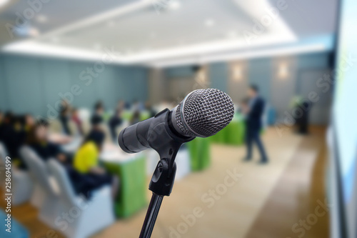 Microphone over the blurred business forum Meeting or Conference Training Learning Coaching Room Concept, Blurred background.